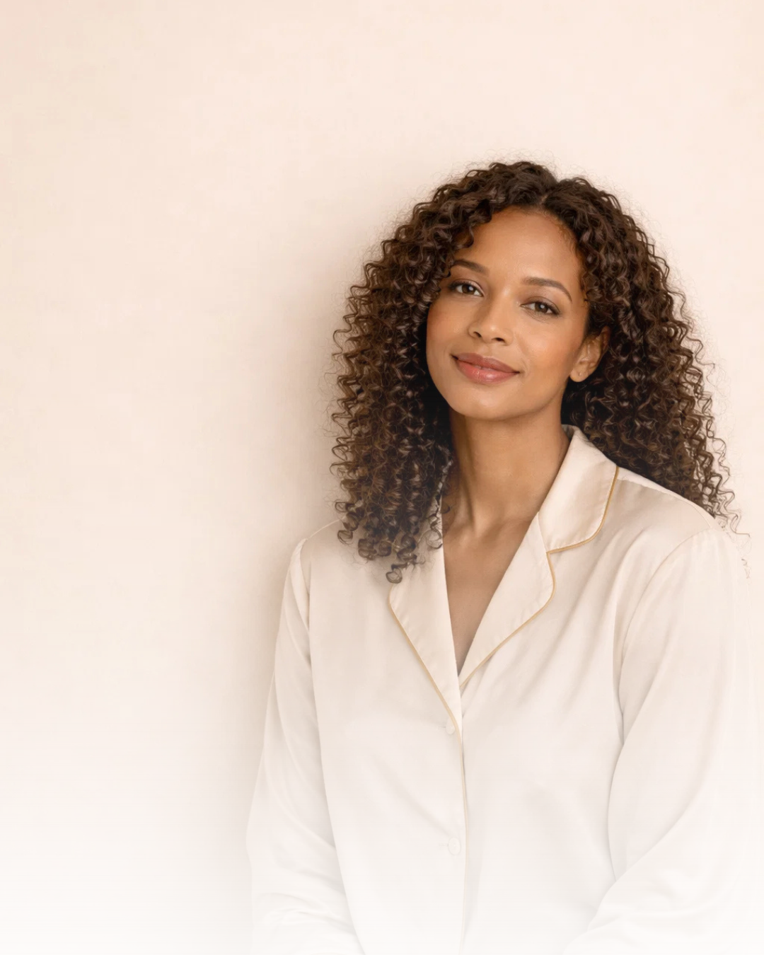 Woman wearing soft perimenopause sleepwear designed to support night sweats, temperature regulation, skin comfort, and better sleep during hormonal changes.