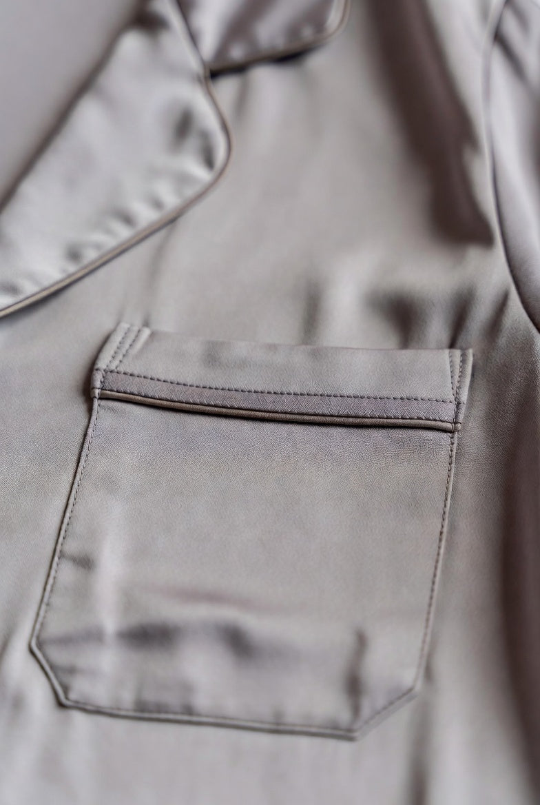 Close-up of Yomisma satin sleepwear showing the piped collar, pocket, and fine stitching, quality sleepwear detail for perimenopause and menopause comfort